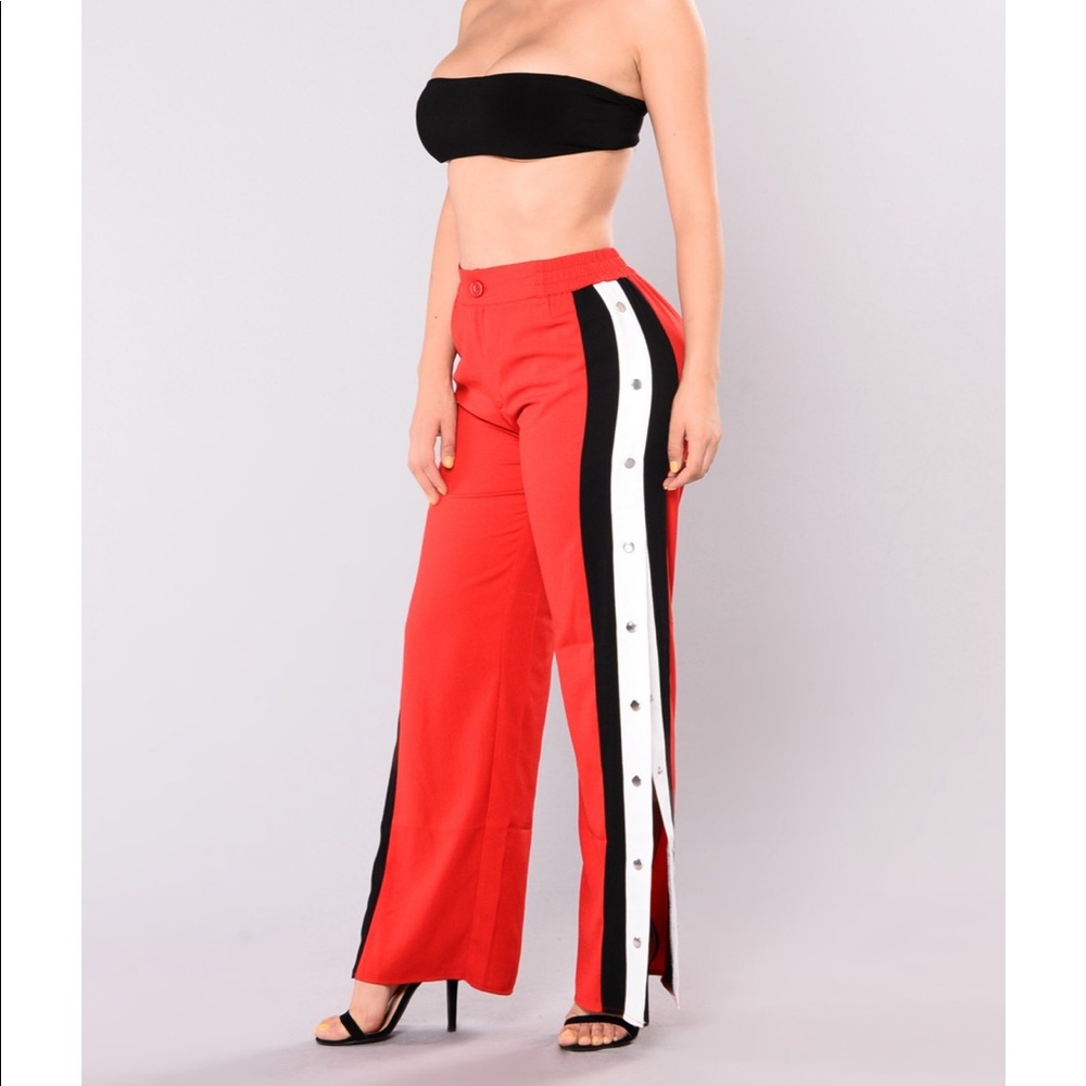 Red snap pants with black and white striped sides